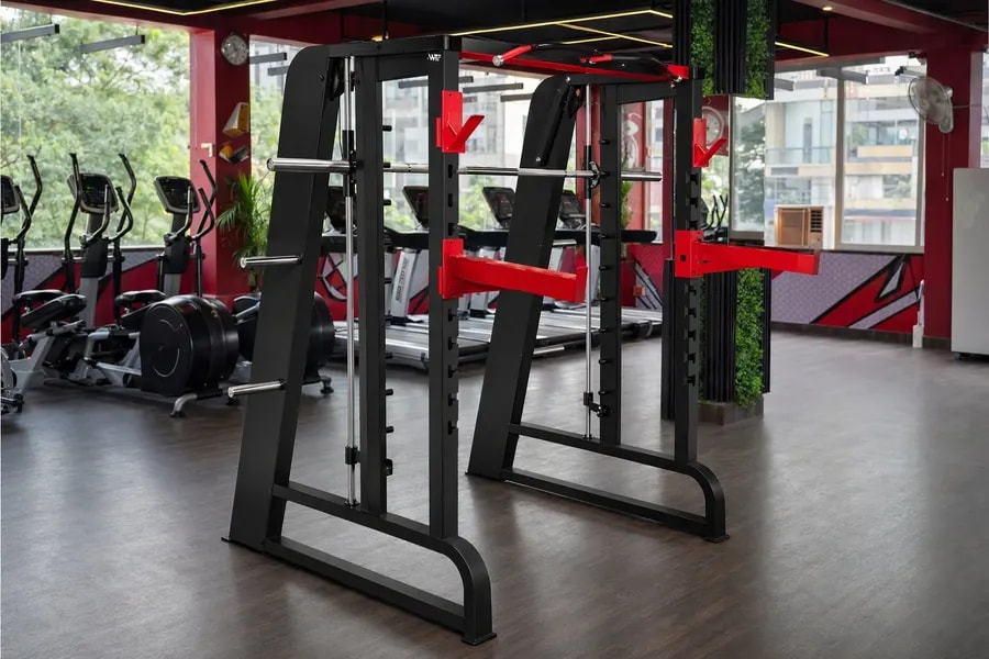 A working WTF gym floor — black and red machines under strip lighting, photographed in one of our operating gyms