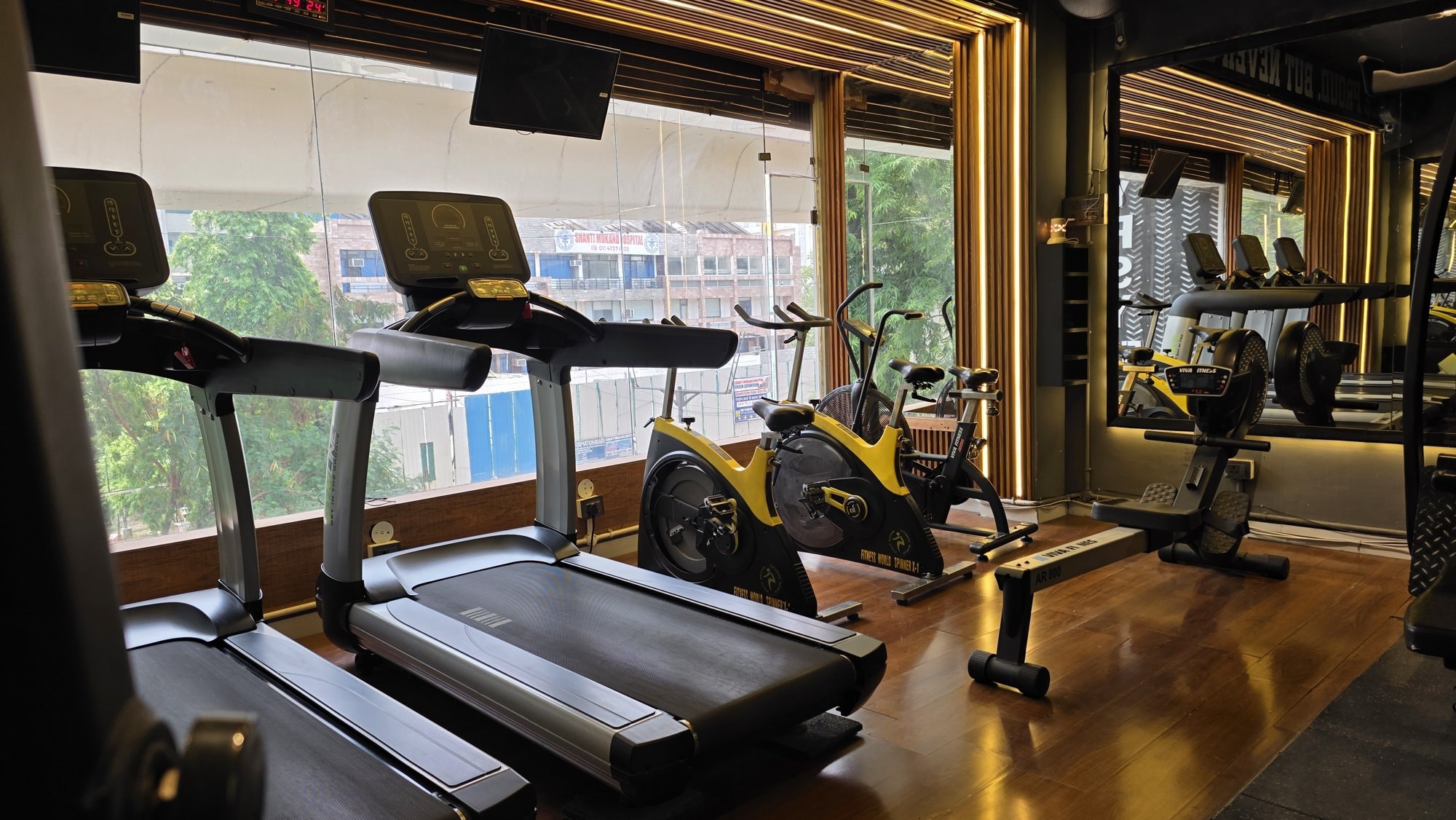 Cardio zone with commercial treadmills at a WTF gym