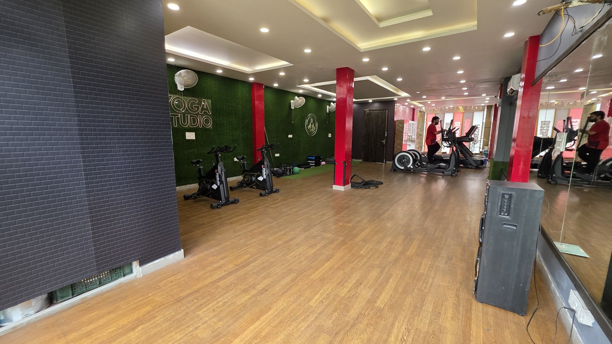 An open, well-lit cardio area with bikes at a WTF gym