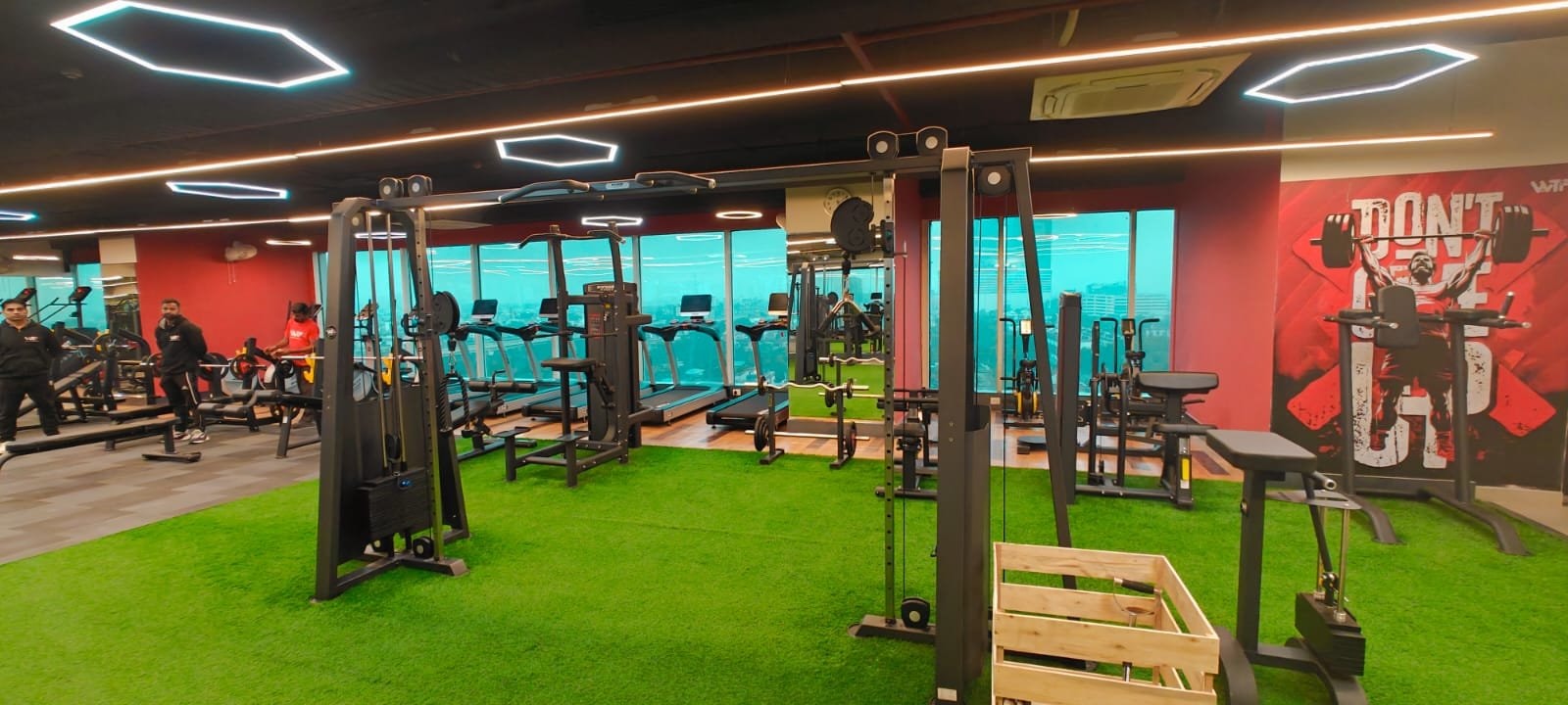 Wooden plyo boxes on the turf zone of a WTF gym